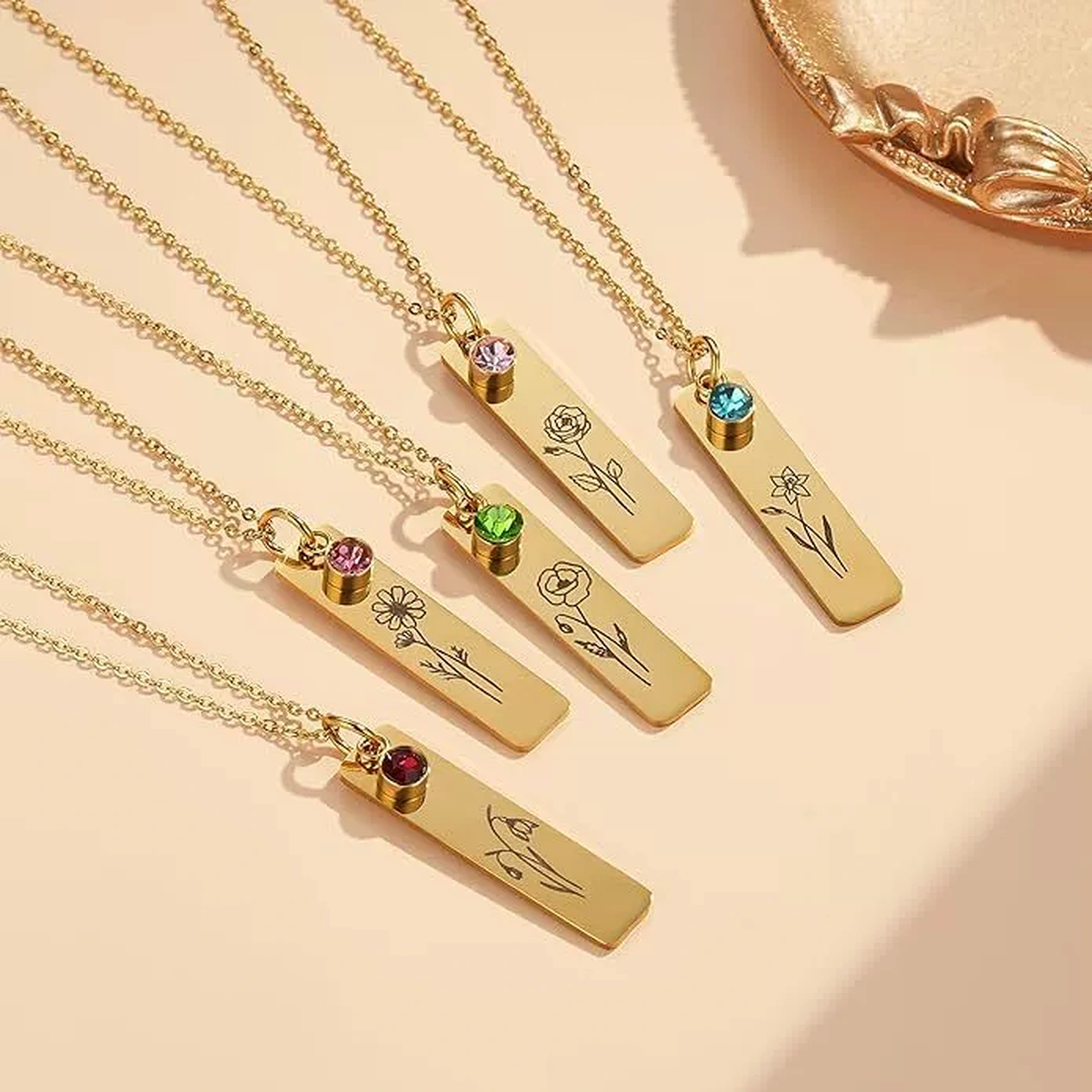 Personalized pendant necklaces with floral motifs and colorful decorative accents